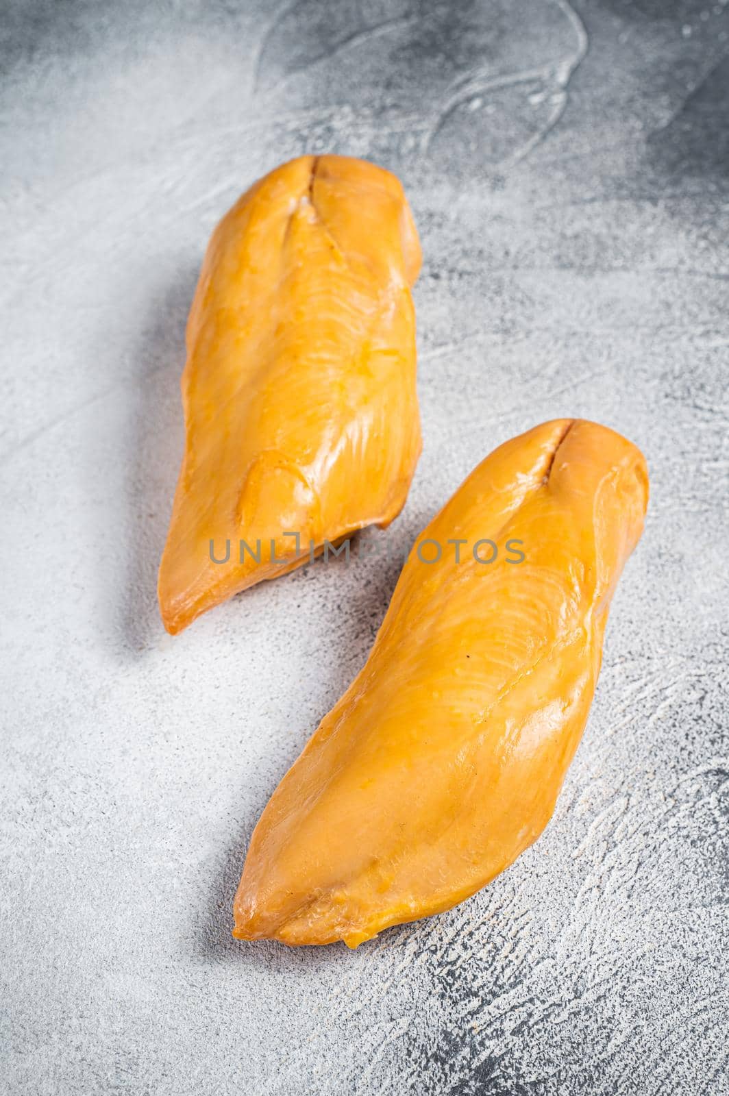 Smoked chicken breast fillet meat delicacy. White background. Top view by Composter
