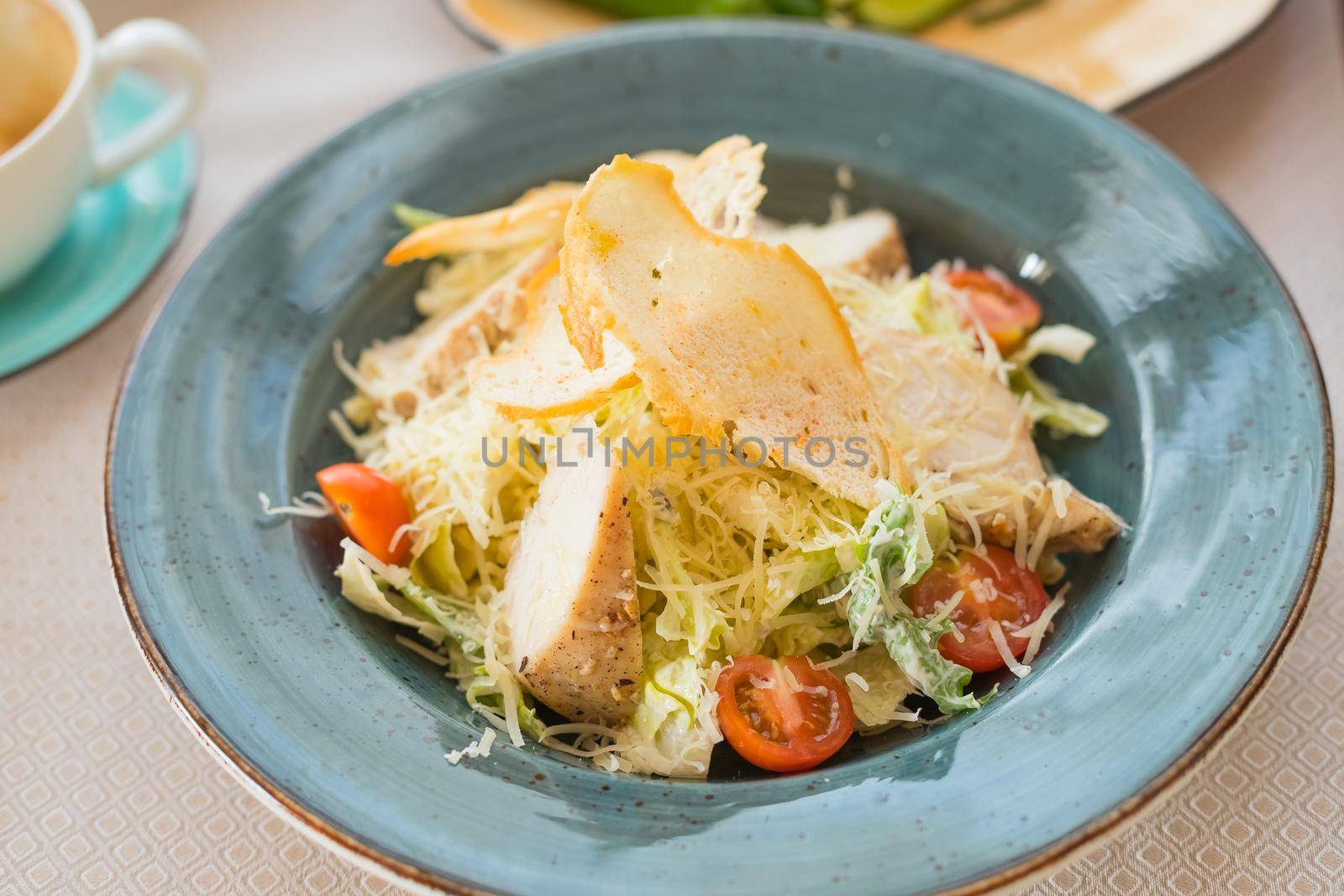 Healthy Grilled Chicken Caesar Salad with Cheese and Croutons