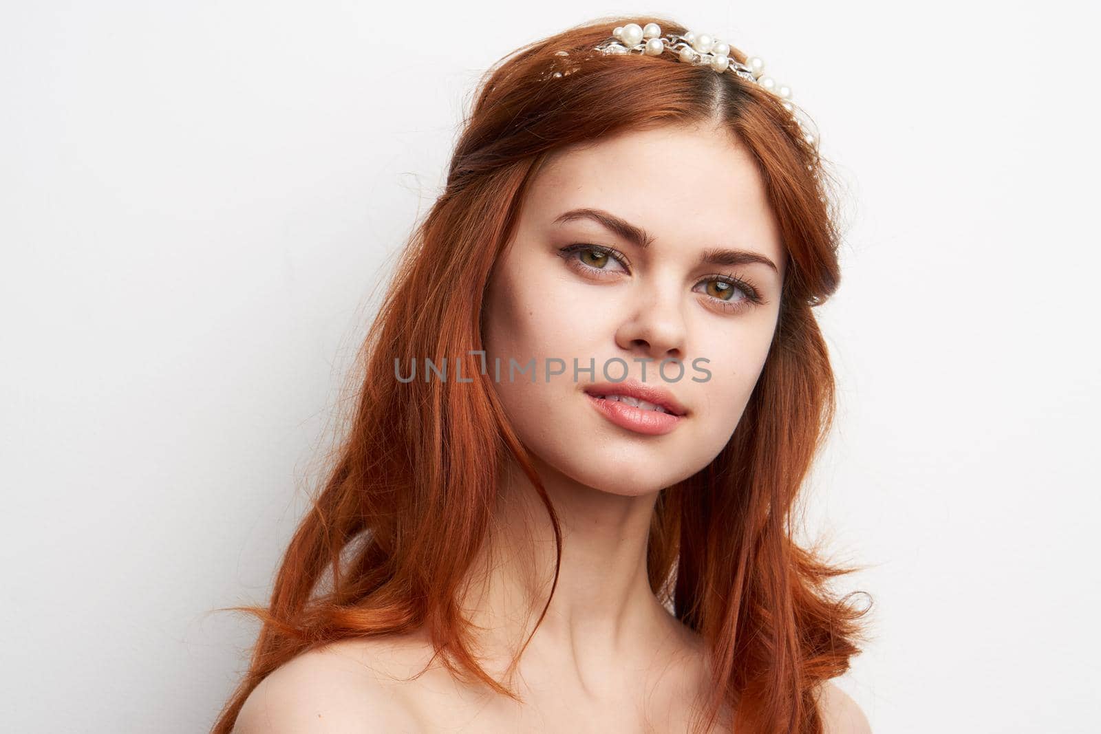 woman bare shoulders red hair makeup glamor smile model. High quality photo