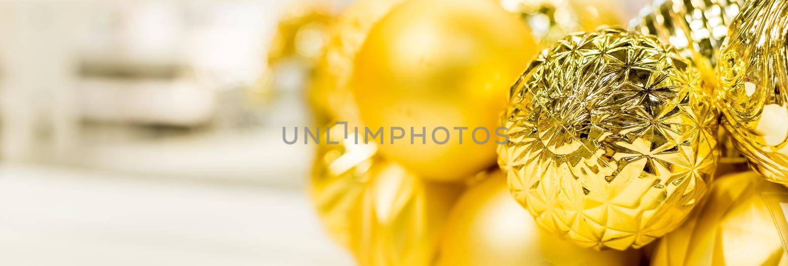 Christmas wreath with glass pink and violet balls isolated on white background