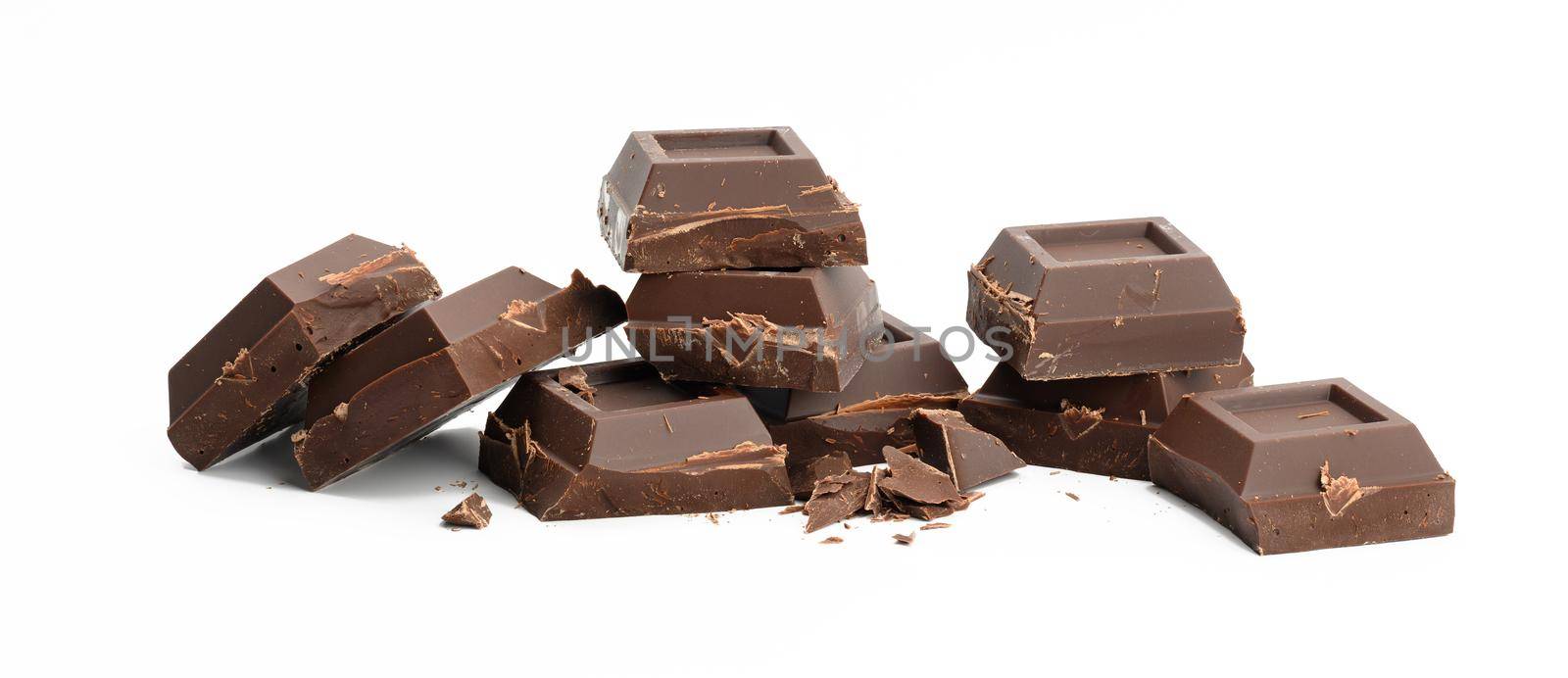 broken black chocolate with pieces isolated on white background. Dessert bar of chocolate, close up