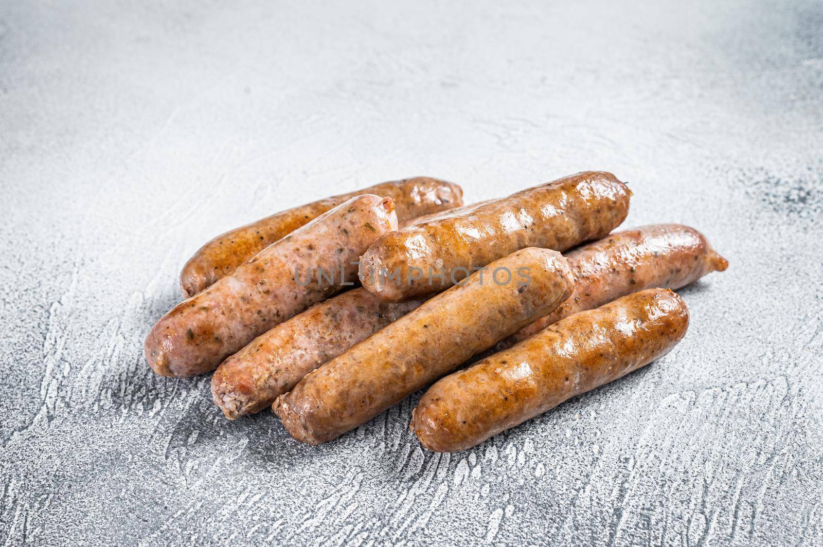 Roasted Bratwurst Hot Dog sausages. White background. Top View by Composter