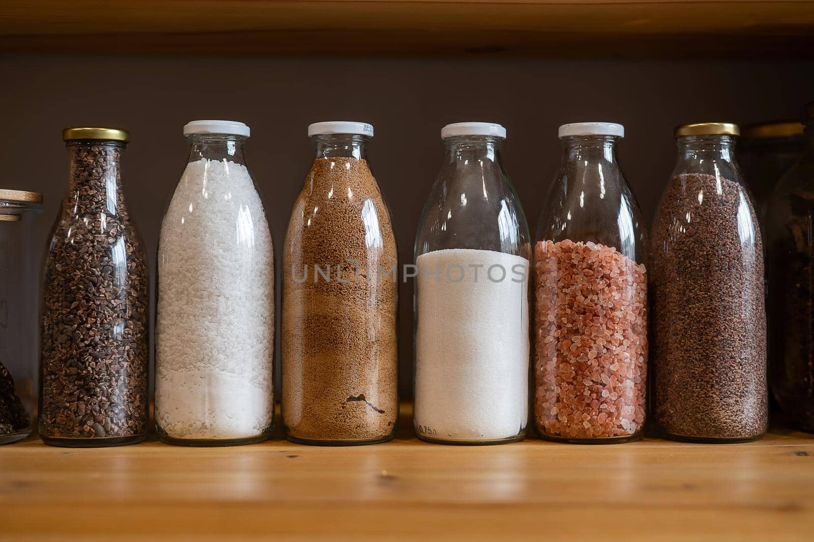 Glass jars with cereals in an eco friendly store. The concept of a grocery store without plastic disposable packaging.