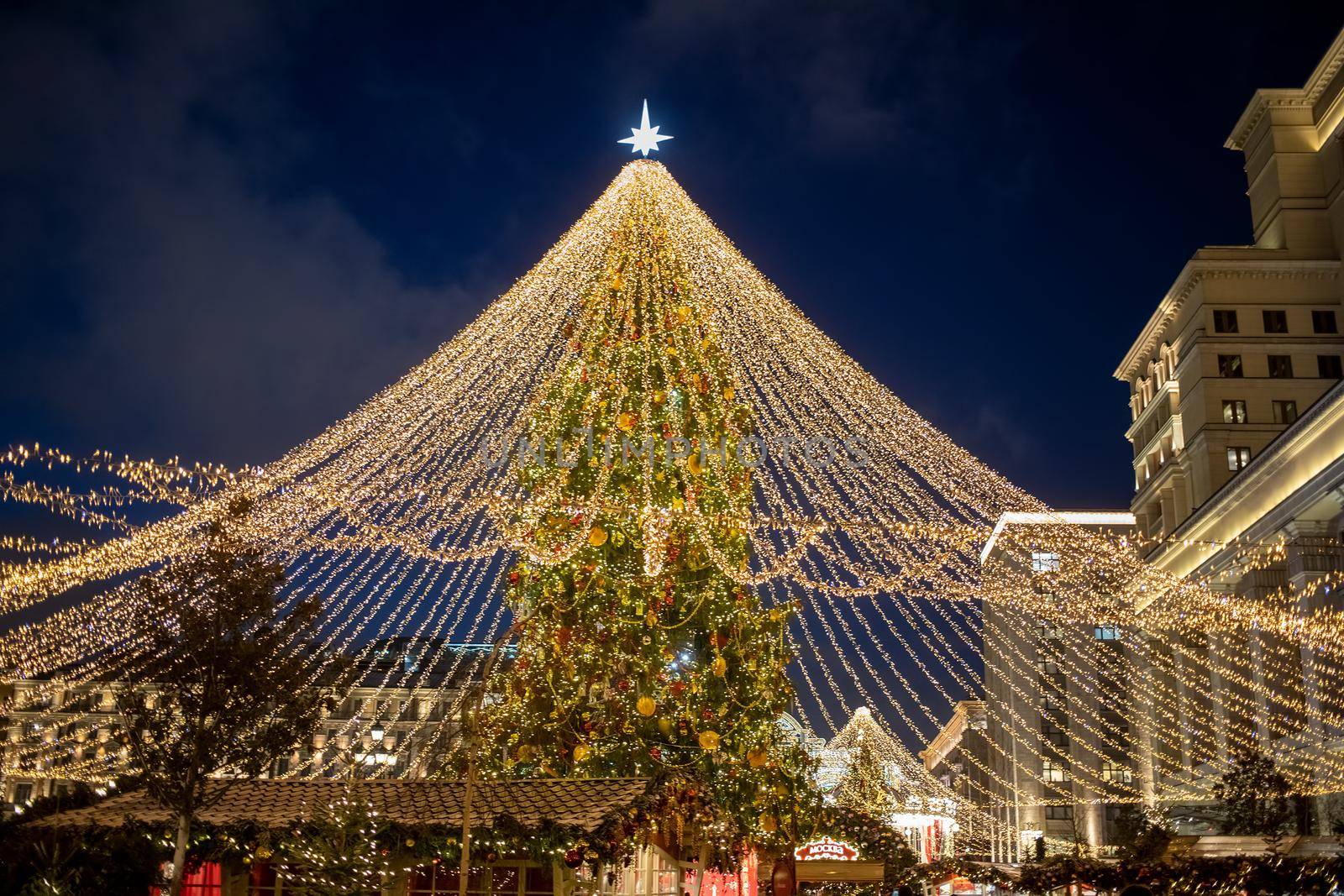 christmas tree in the center of town fair in night. High quality photo