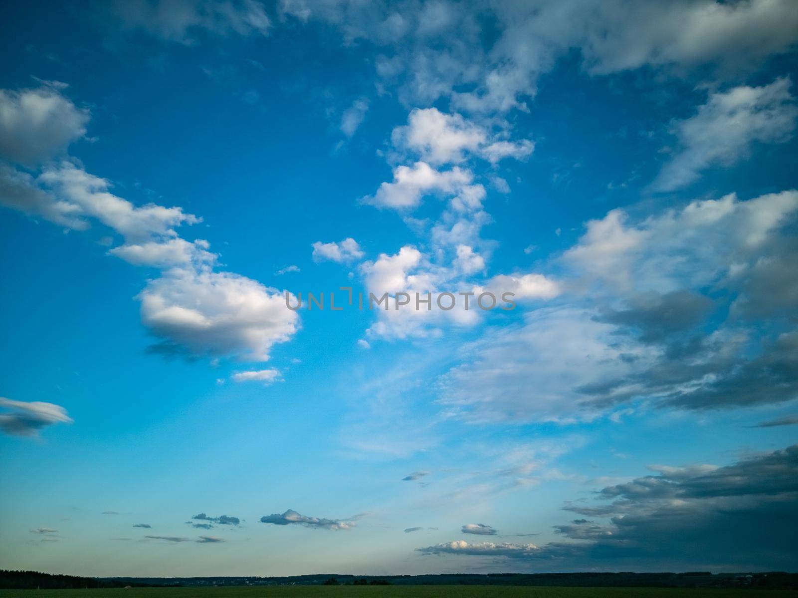 beautiful countryside landscape. deep blue sky with white clouds in daylight