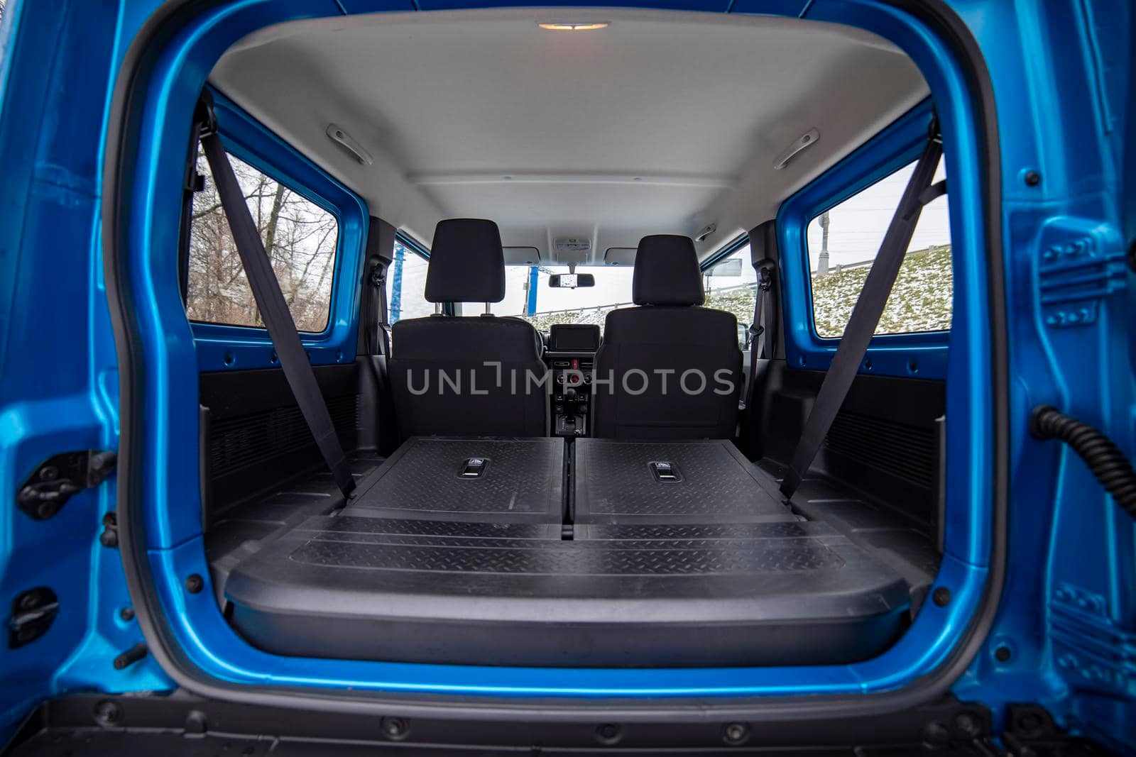 empty clean car trunk with seats folded into a flat flor of suv crossover