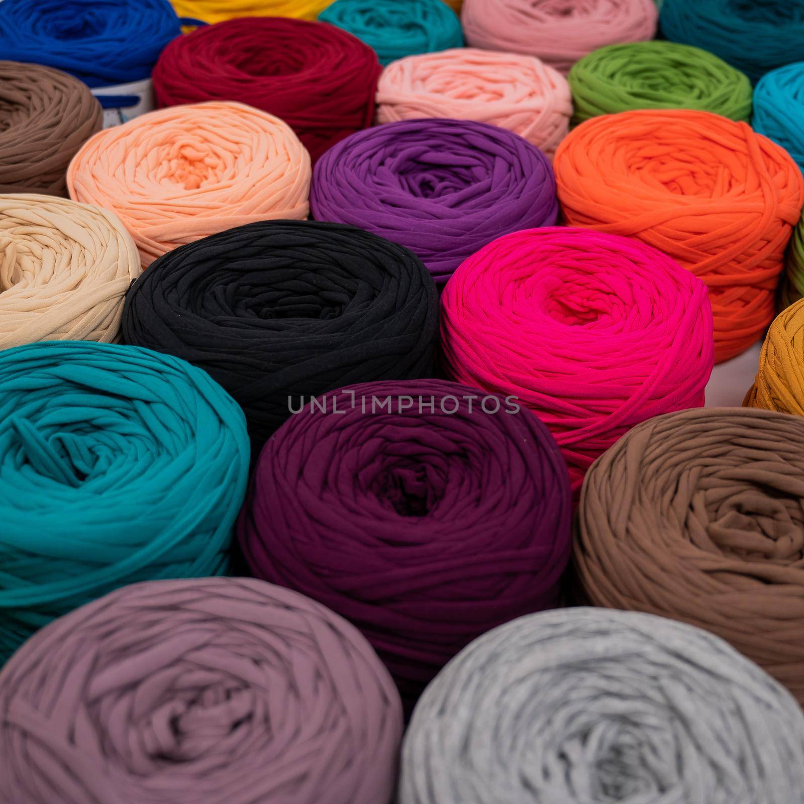 Close-up of multi-colored cotton skeins. Shop assortment for handmade by mrwed54