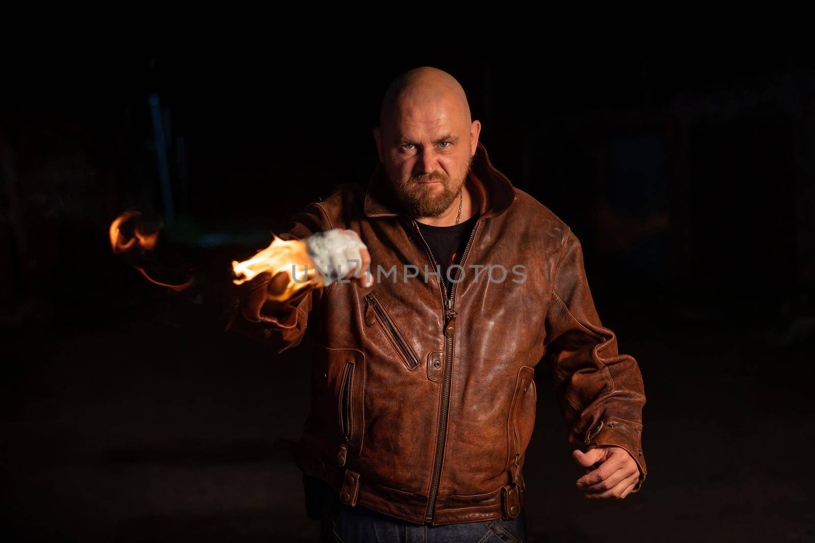Bald Caucasian man beats with a burning fist. by mrwed54