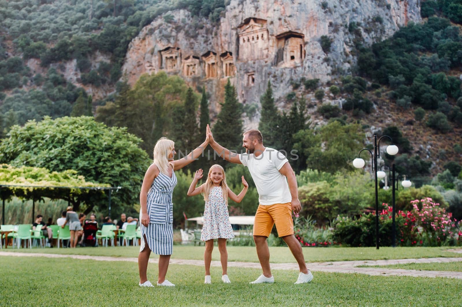 Happy family travel by car. People having fun in the mountains. Father, mother and child on summer vacation.