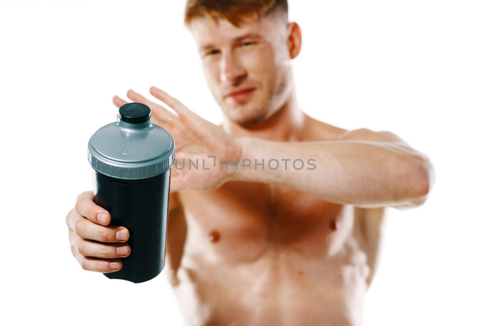 athletic man with a pumped-up torso drink bottle sportspit by Vichizh