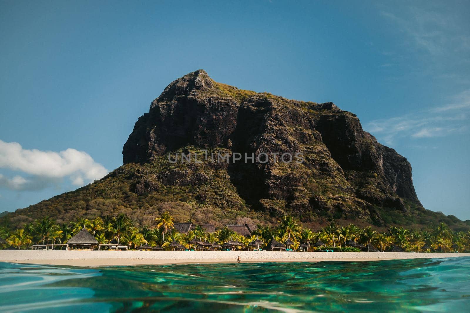 Beautiful beach, palm trees, and clouds on the horizon. Africa, Mauritius, South, near Le Morne.