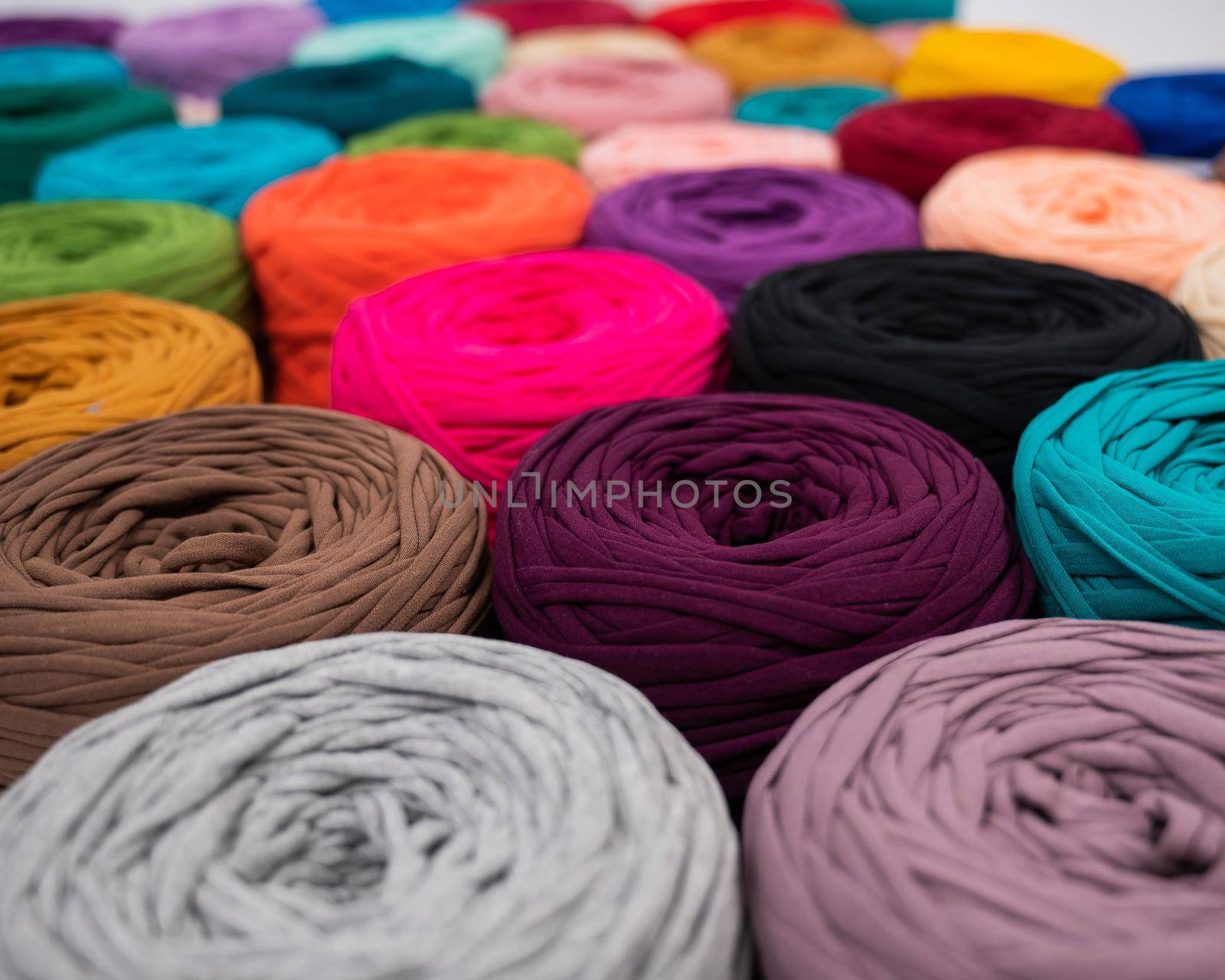 Close-up of multi-colored cotton skeins. Shop assortment for handmade by mrwed54