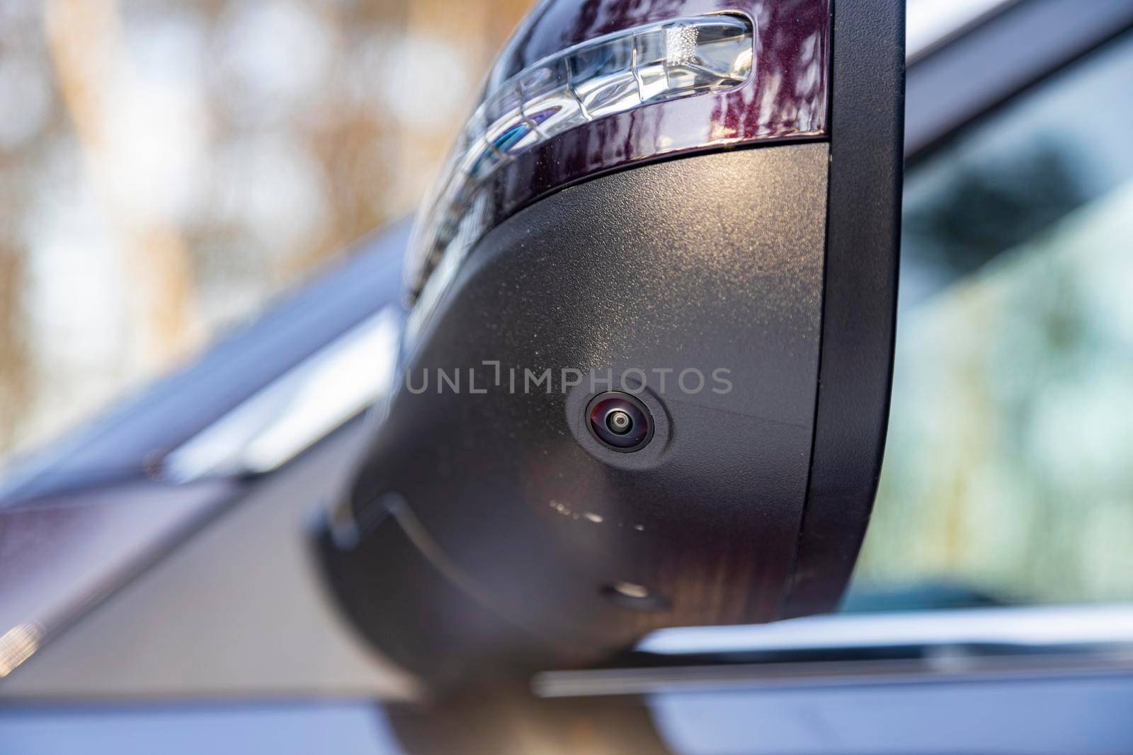 closeup of a surround view camera in the side mirror of a modern car rear view. camera of parking assuist by Mariaprovector