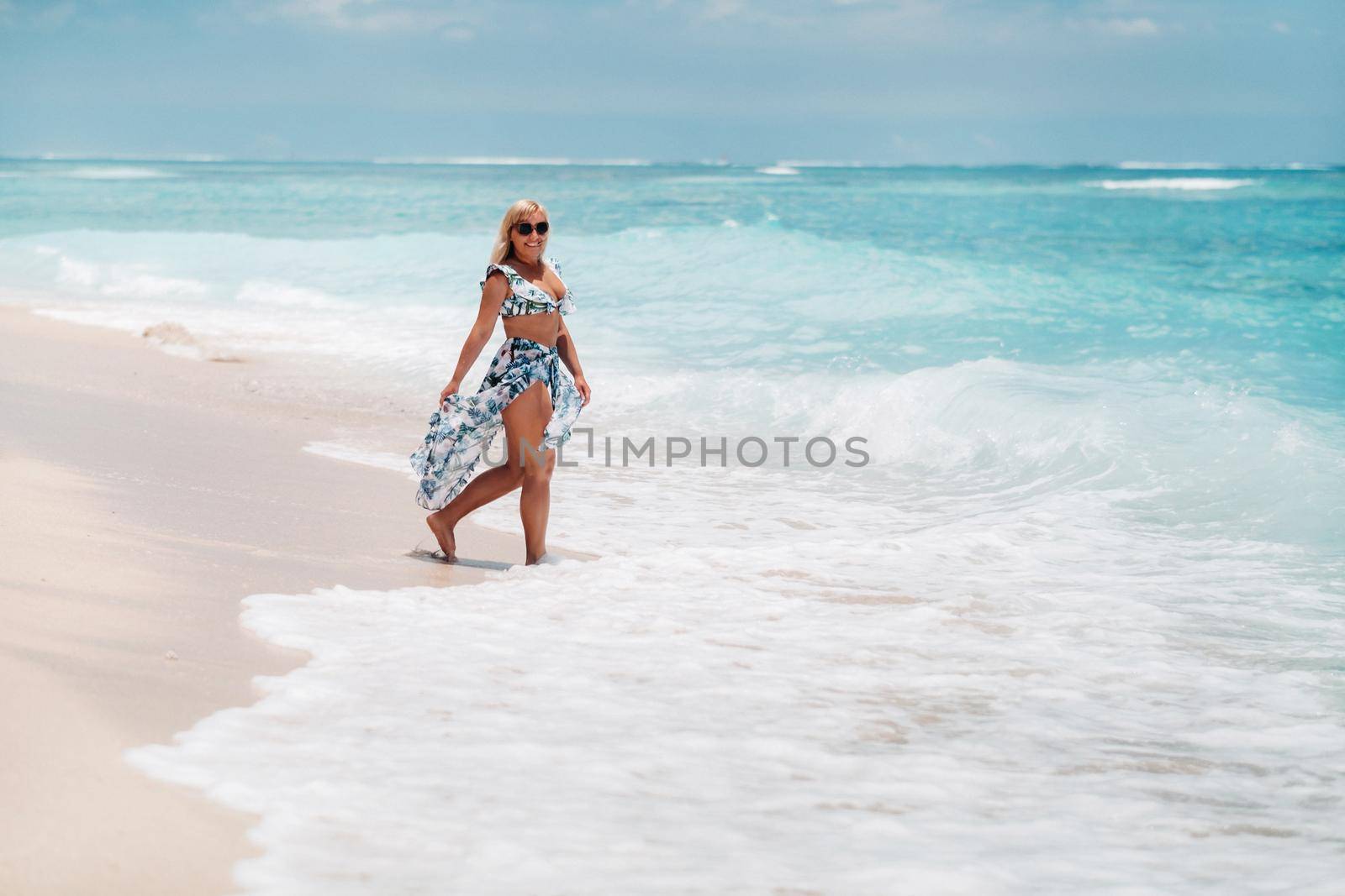 Young woman in a swimsuit relaxing on a tropical beach. Tropical vacation in paradise.mauritius island.