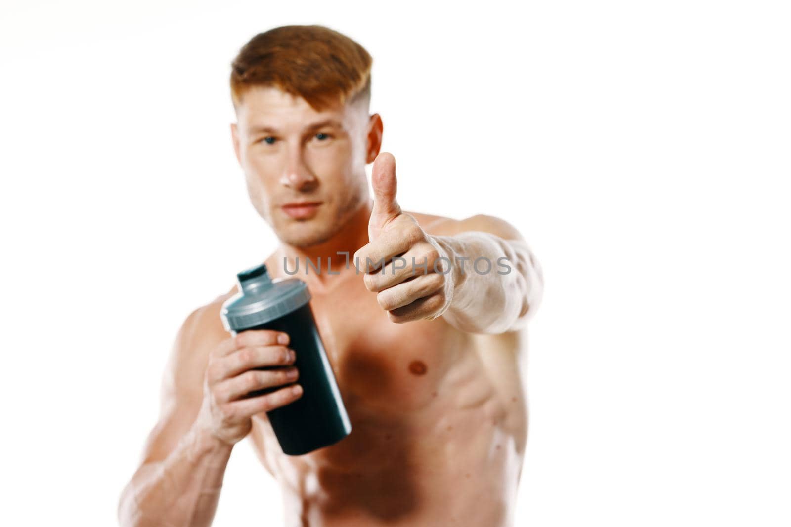 athletic man with a pumped-up torso drink bottle sportspit by Vichizh