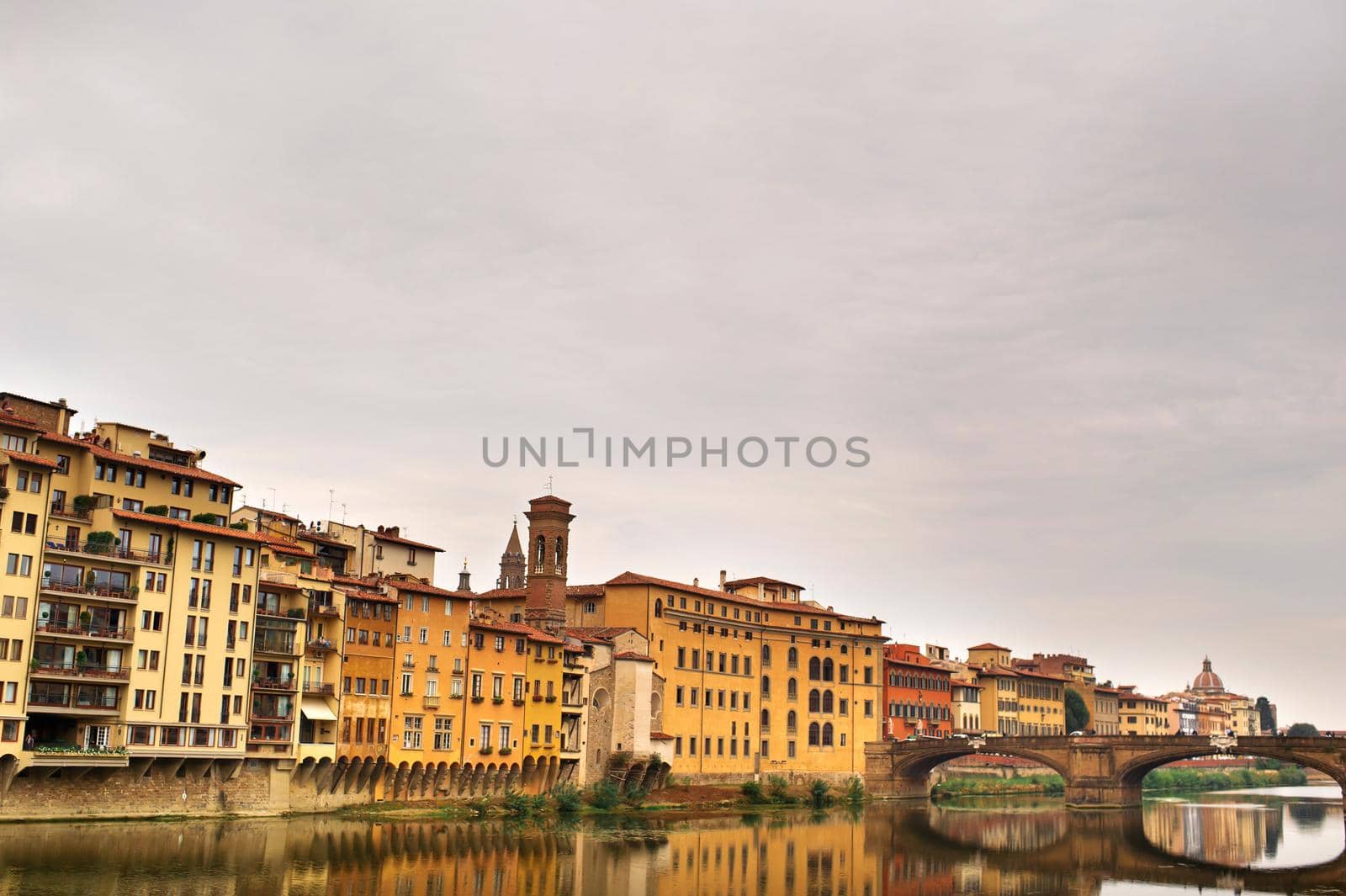 The embankment and bridge of the Holy Trinity of the Ponte Santa Trinita on the Arno river in Florence. italian.