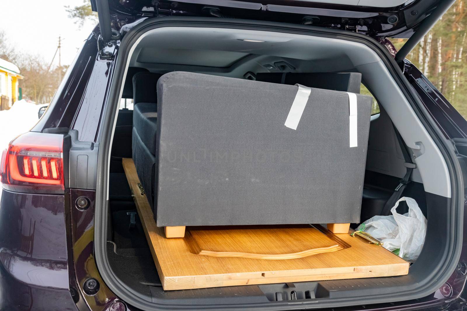 furniture in the passenger car. SUV large trunk volume. no people. close up.