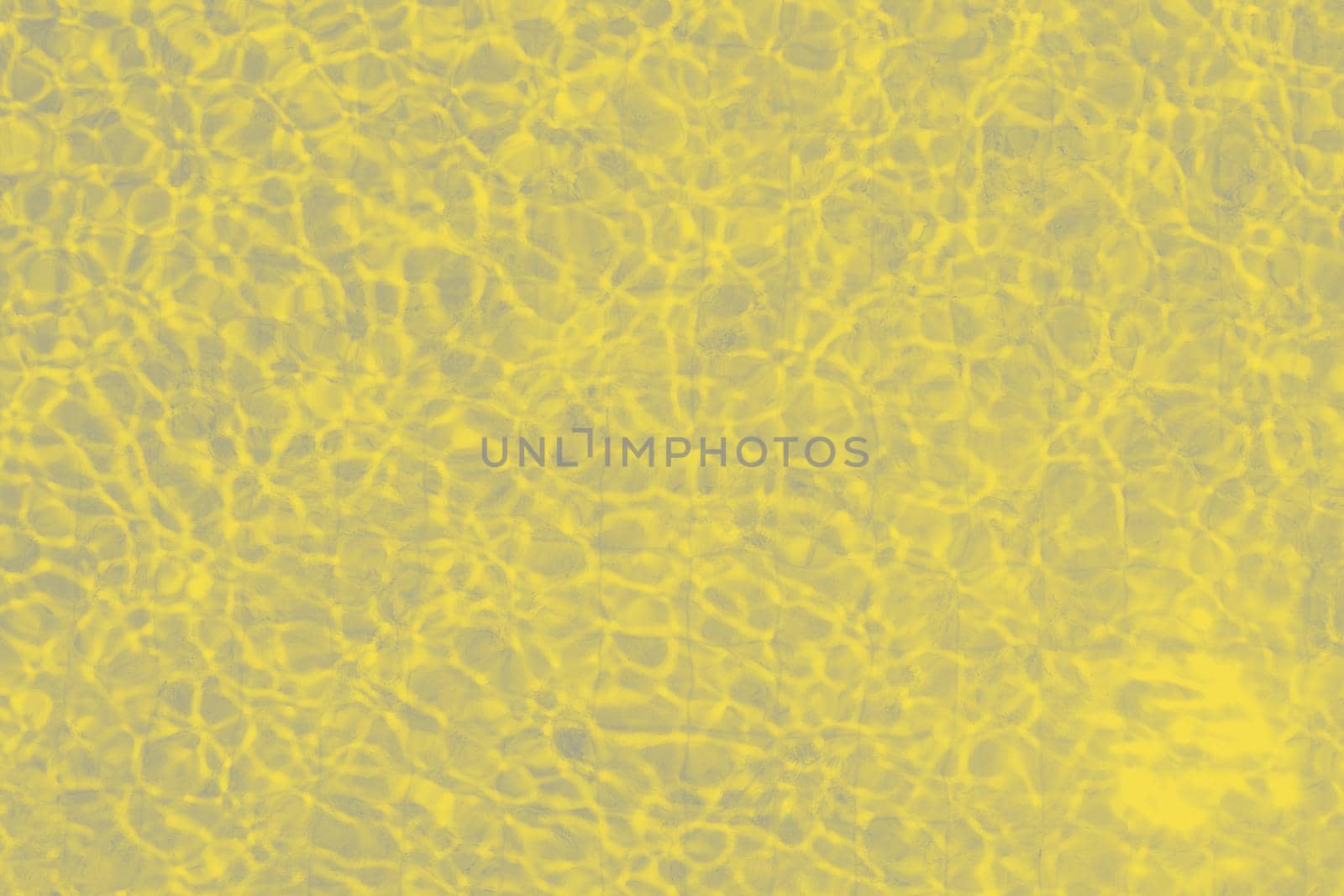 yellow colored texture of water in swimming pool. top view
