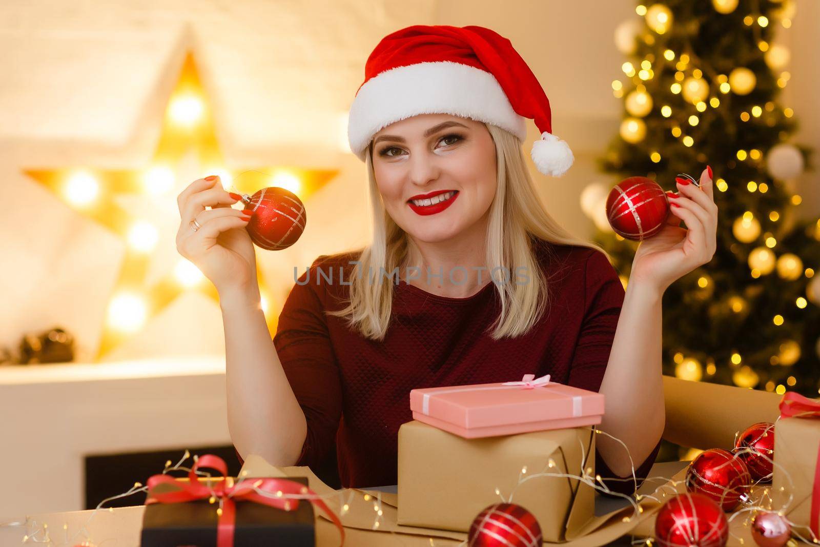 picture of cheerful santa helper girl with gift box