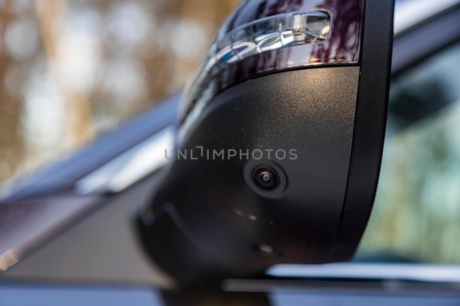 surround cam monitor system system in a modern car.. side view rearview mirror of modern car with round view camera by Mariaprovector