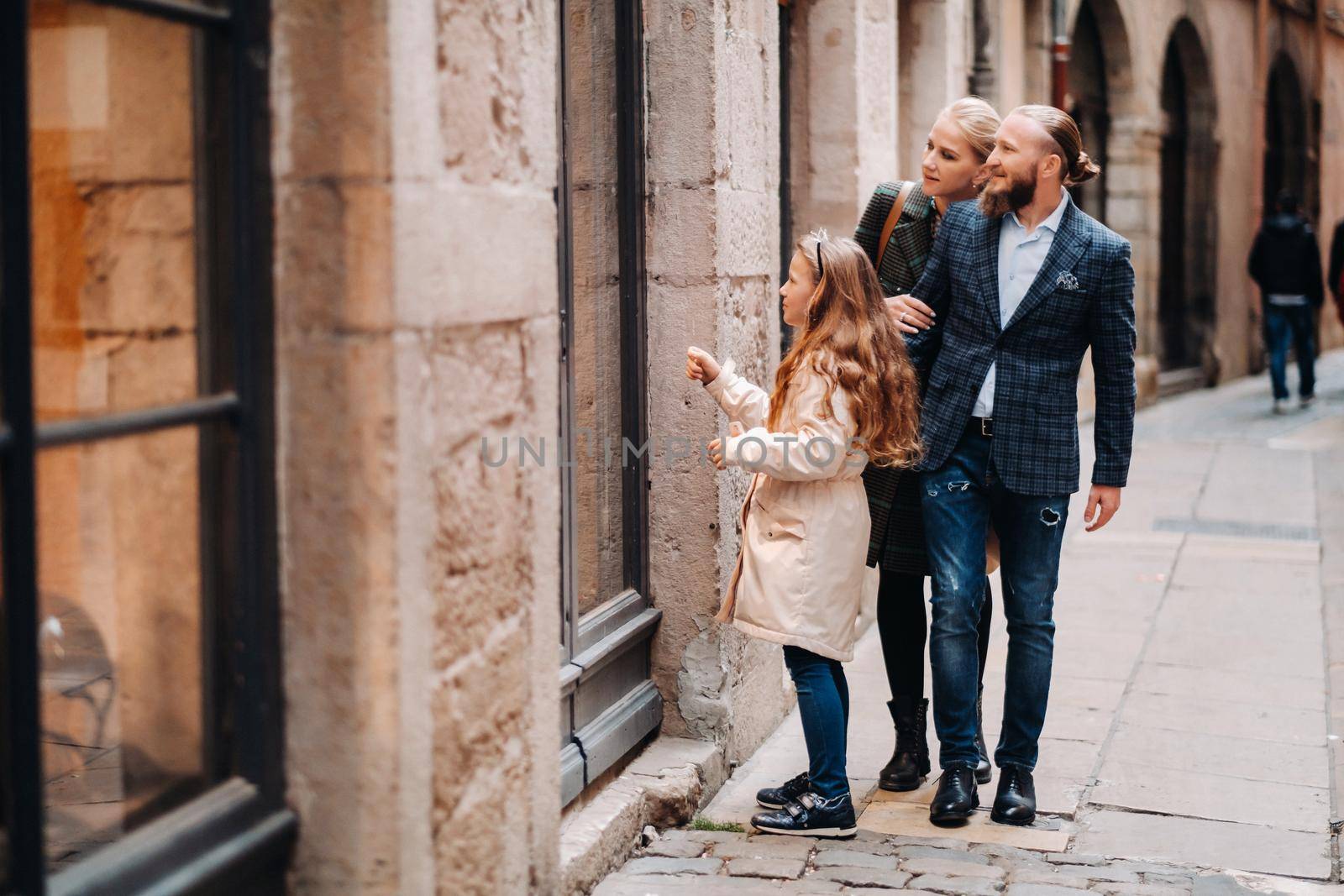 A beautiful family with strolls through the old city of Lyon in France.Family trip to the old cities of France.
