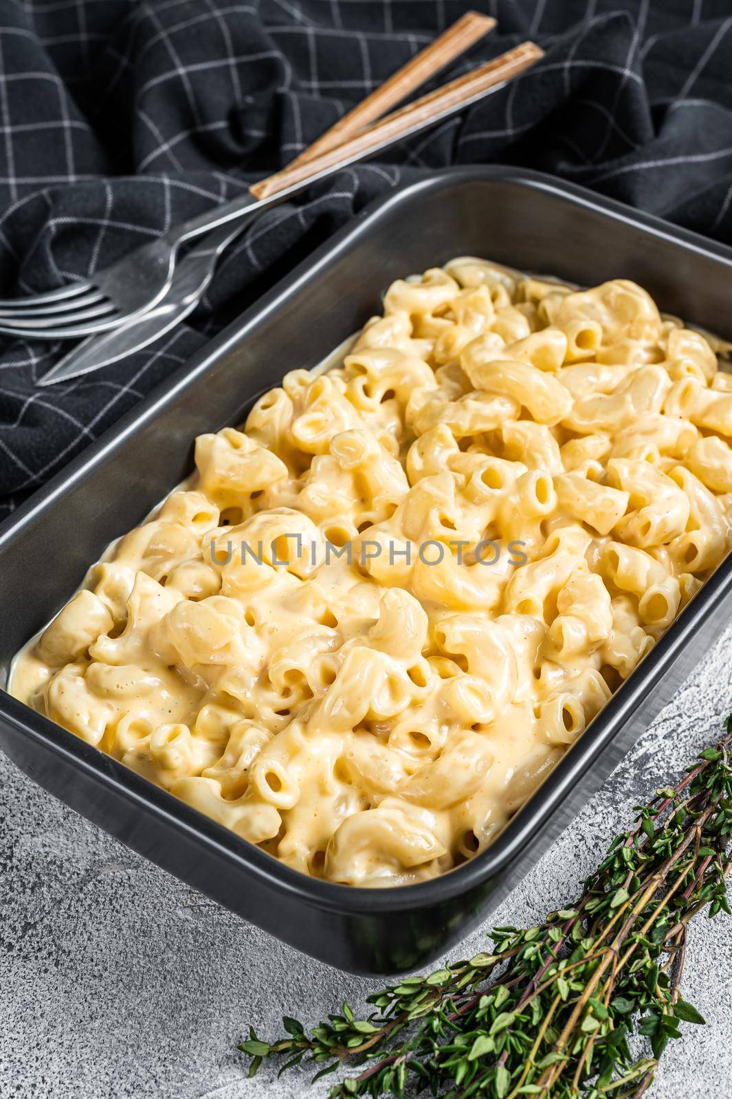Mac and cheese american macaroni pasta with cheesy Cheddar sauce. White background. Top view.