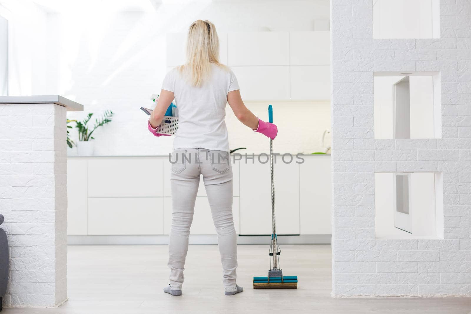 Portrait of housewife who is ready for housework. by Andelov13