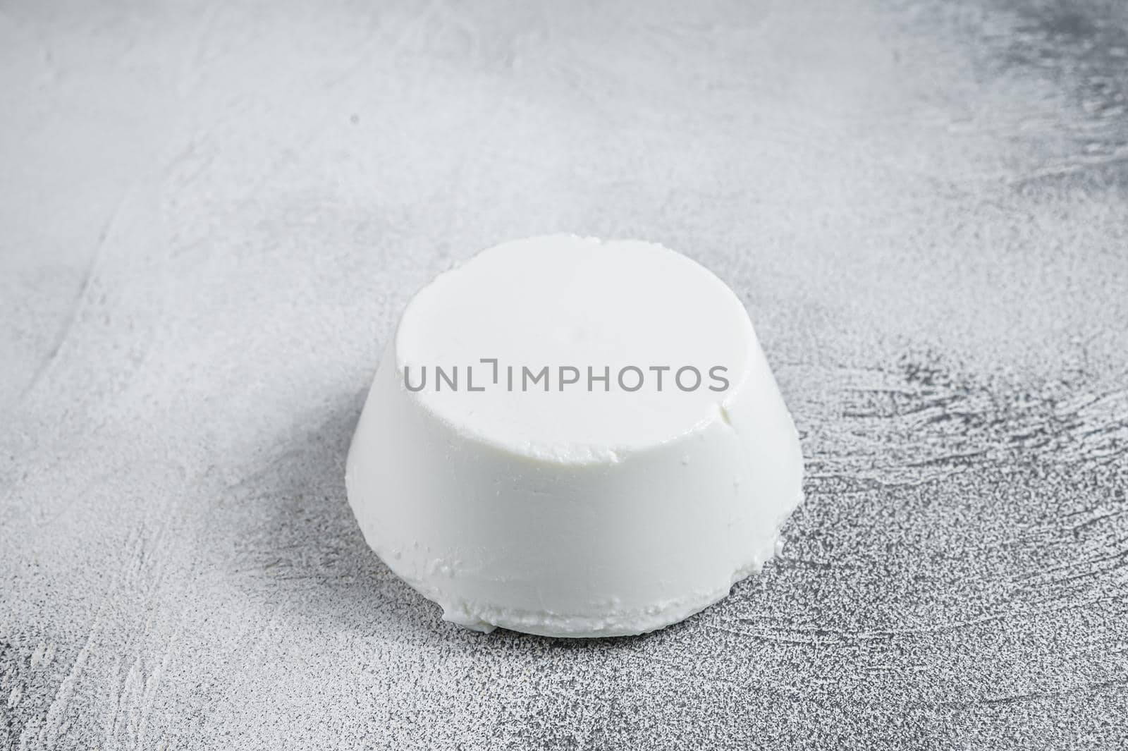 Ricotta cream Cheese on kitchen table. White background. Top view by Composter