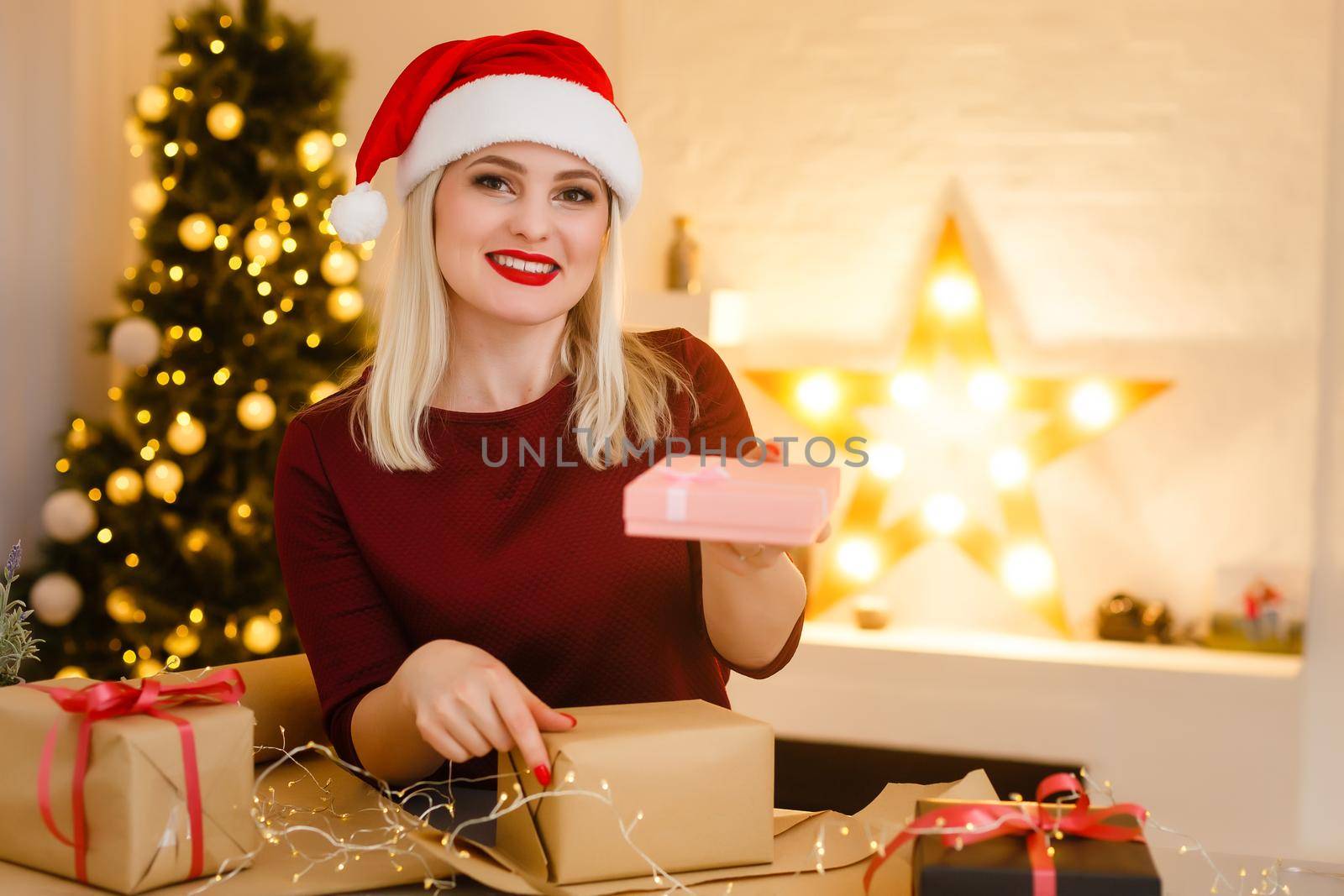 Closeup on table where woman making Christmas decorations. Upper view