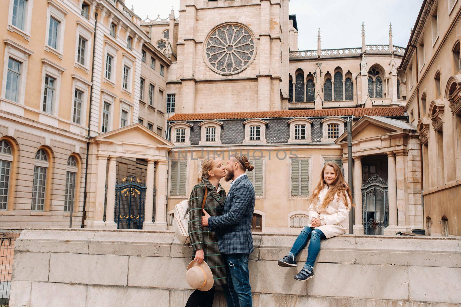 A beautiful family with strolls through the old city of Lyon in France.Family trip to the old cities of France.