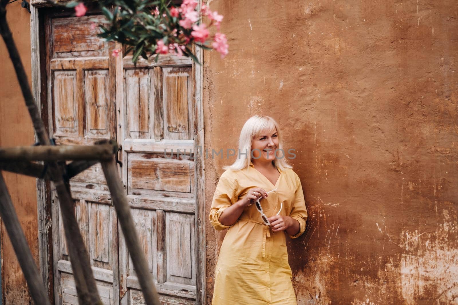 A girl walks in the Old town of La Laguna on the island of Tenerife on a Sunny day.A tourist walks through the old city of Tenerife in the Canary Islands.Spain