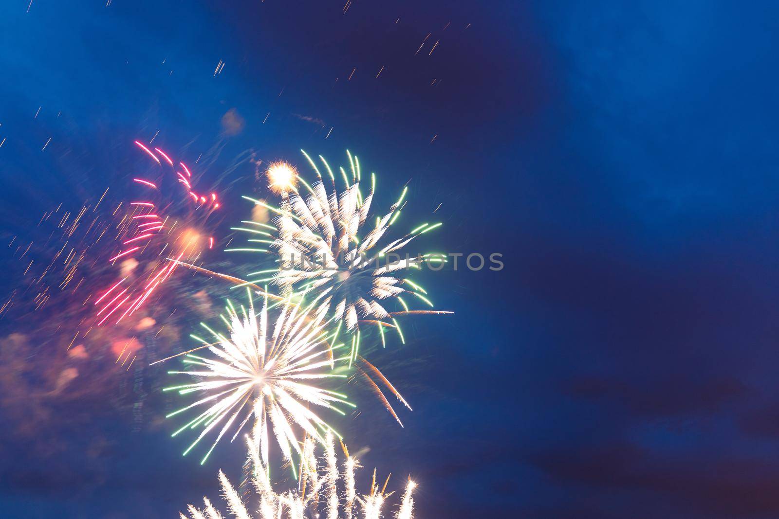 Brightly colorful fireworks and salute of various colors in the night sky. Independence Day, 4th of July, Fourth of July or New Year. by AlikMulikov