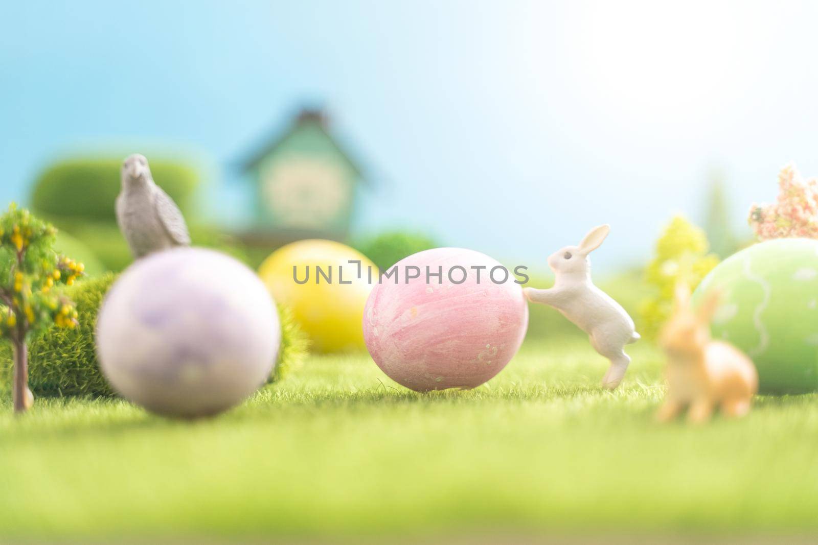 Easter egg outside in the grass with evening sun from behind