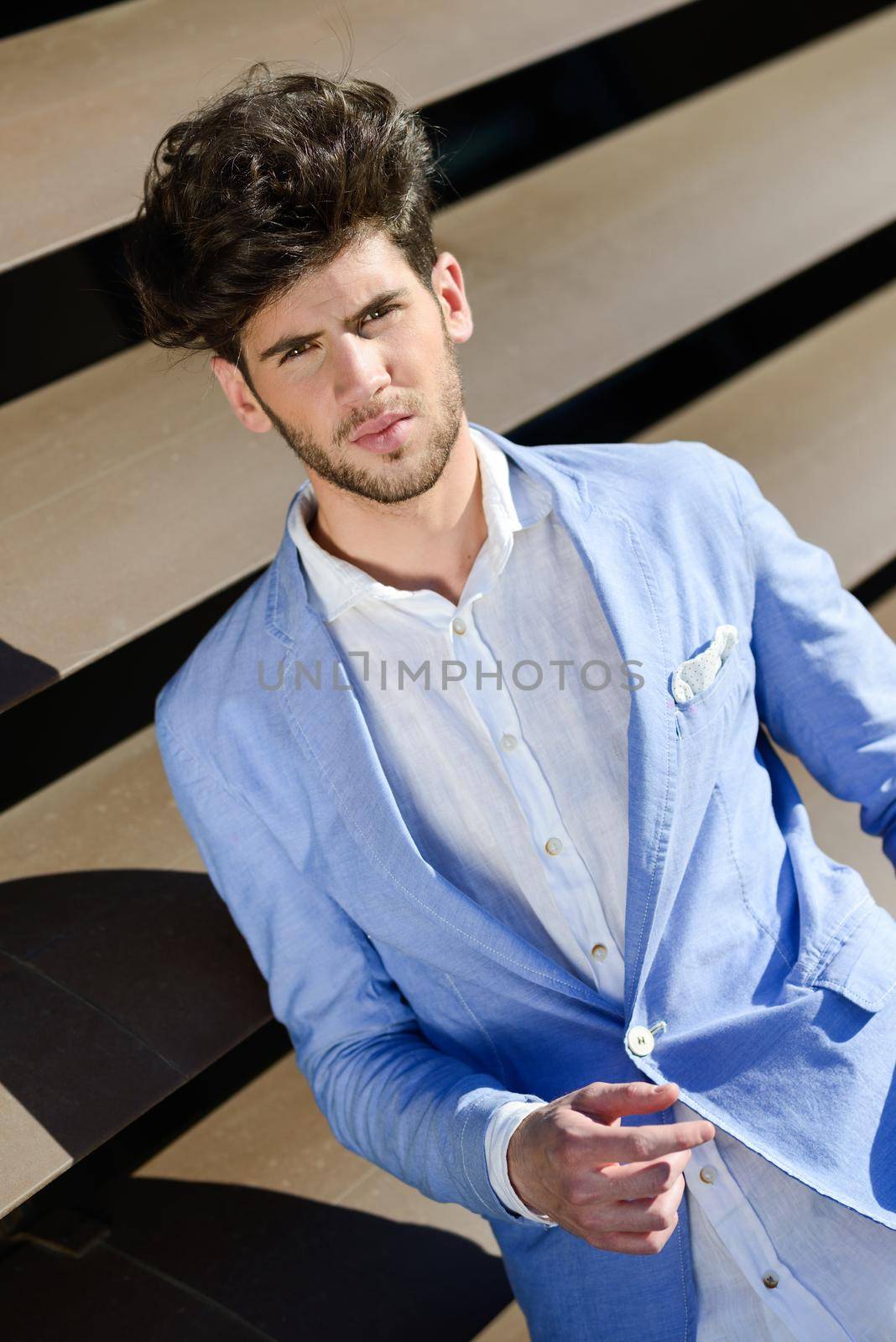 Attractive young handsome man, model of fashion in urban background by javiindy