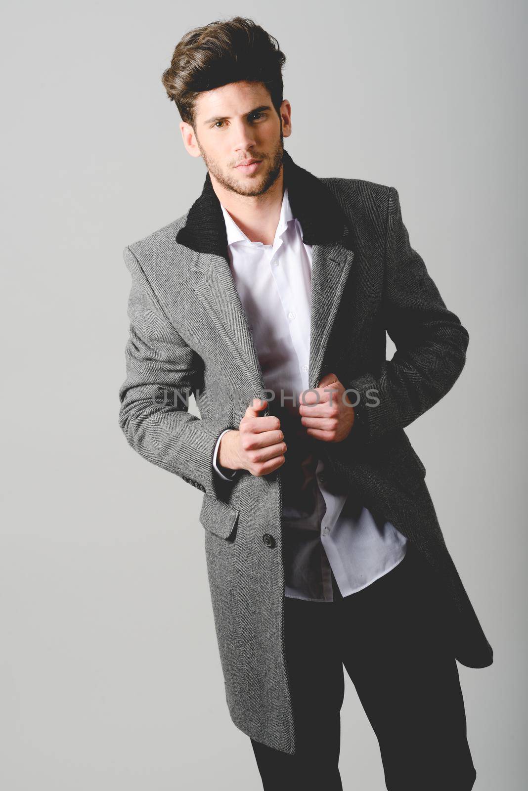 Portrait of handsome man wearing coat