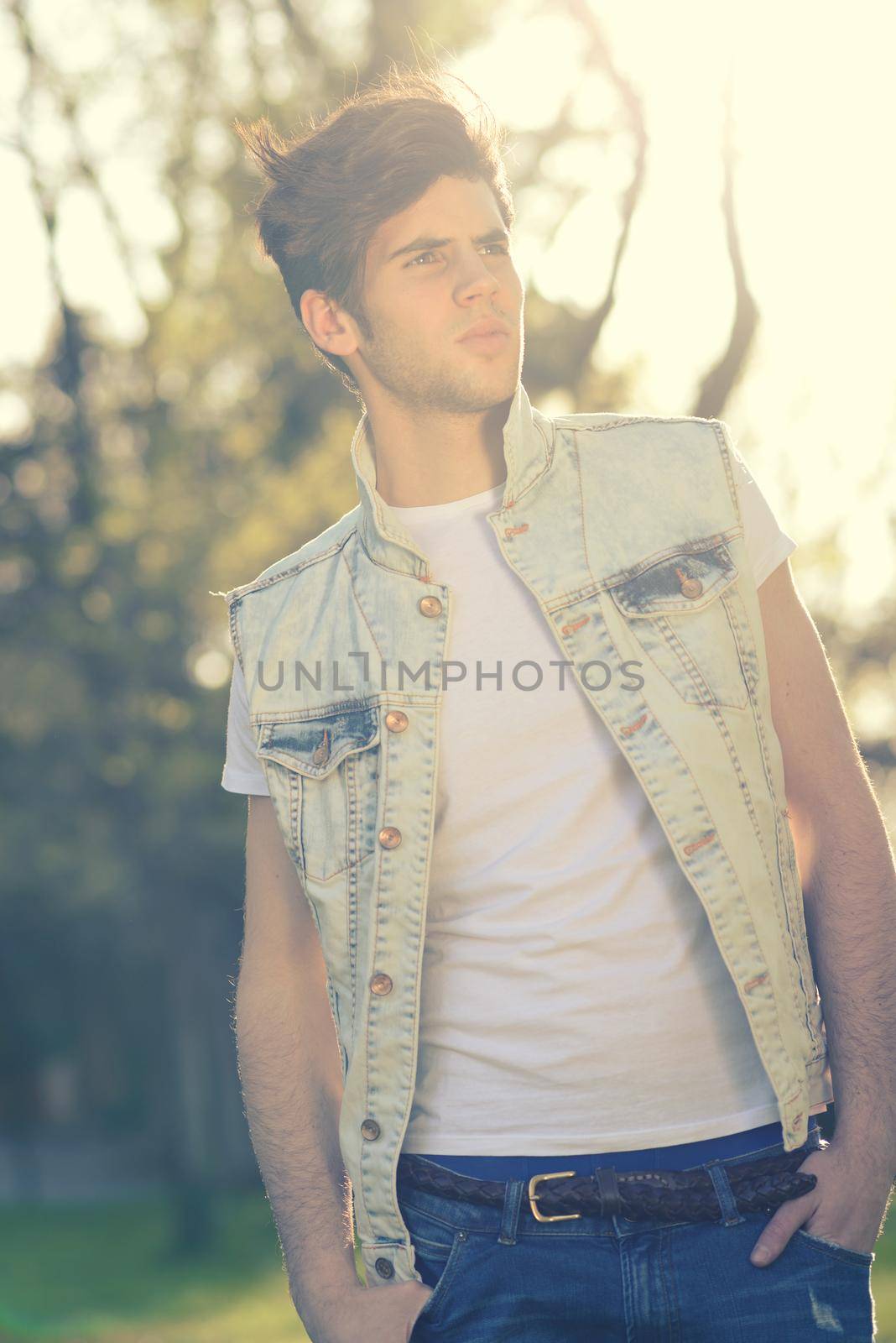 Portrait of a young handsome man, model of fashion, with modern hairstyle