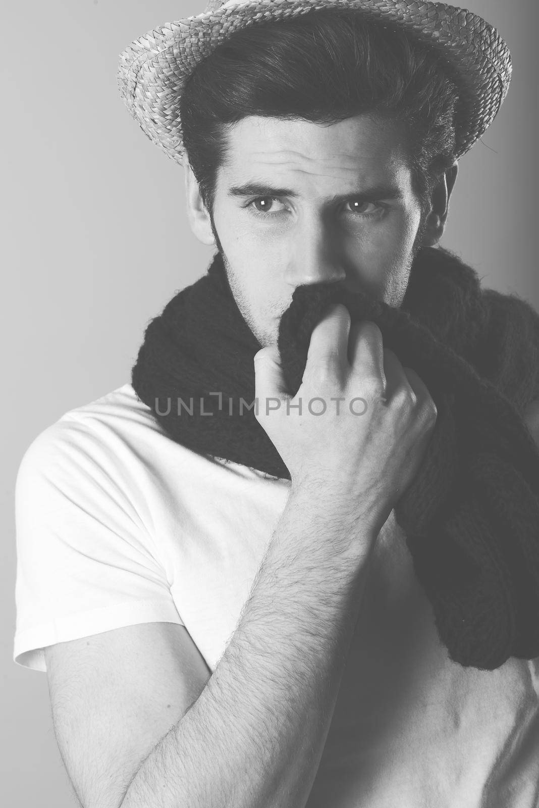 Portrait of handsome man wearing hat and scarf