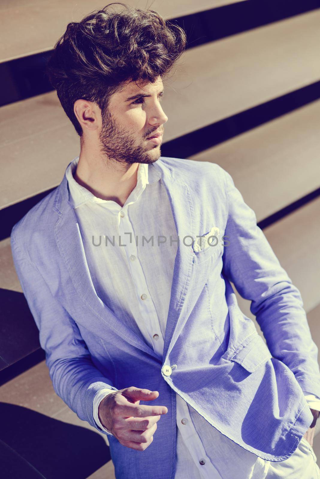 Attractive young handsome man, model of fashion in urban background by javiindy
