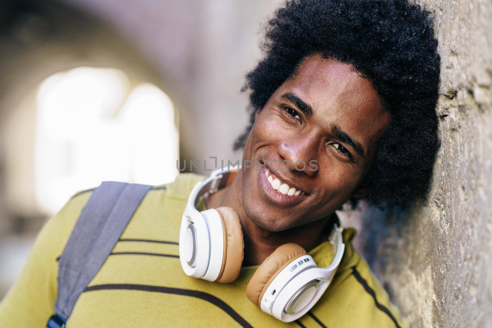 Black man with afro hair sightseeing in Granada by javiindy