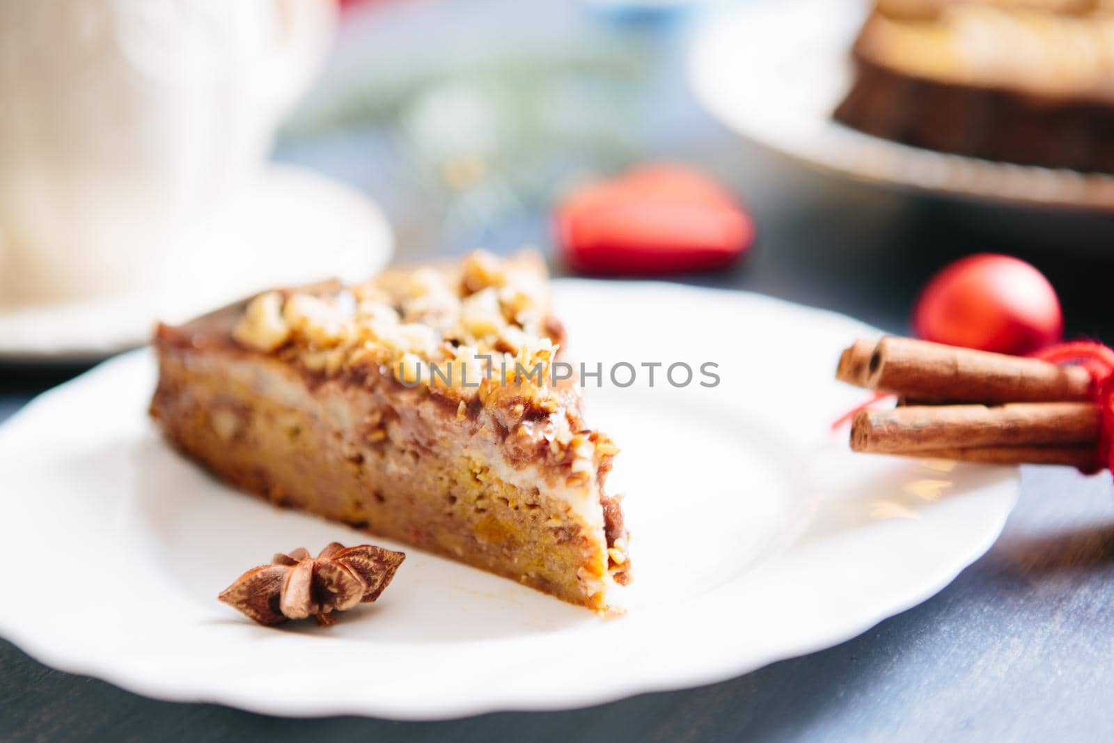 Nuts and honey cake, selective focus Gluten free christmas nut cake on a gray table with christmas decorations .