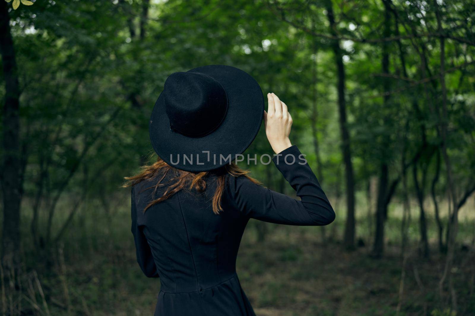 cheerful woman witch in the forest posing fantasy. High quality photo