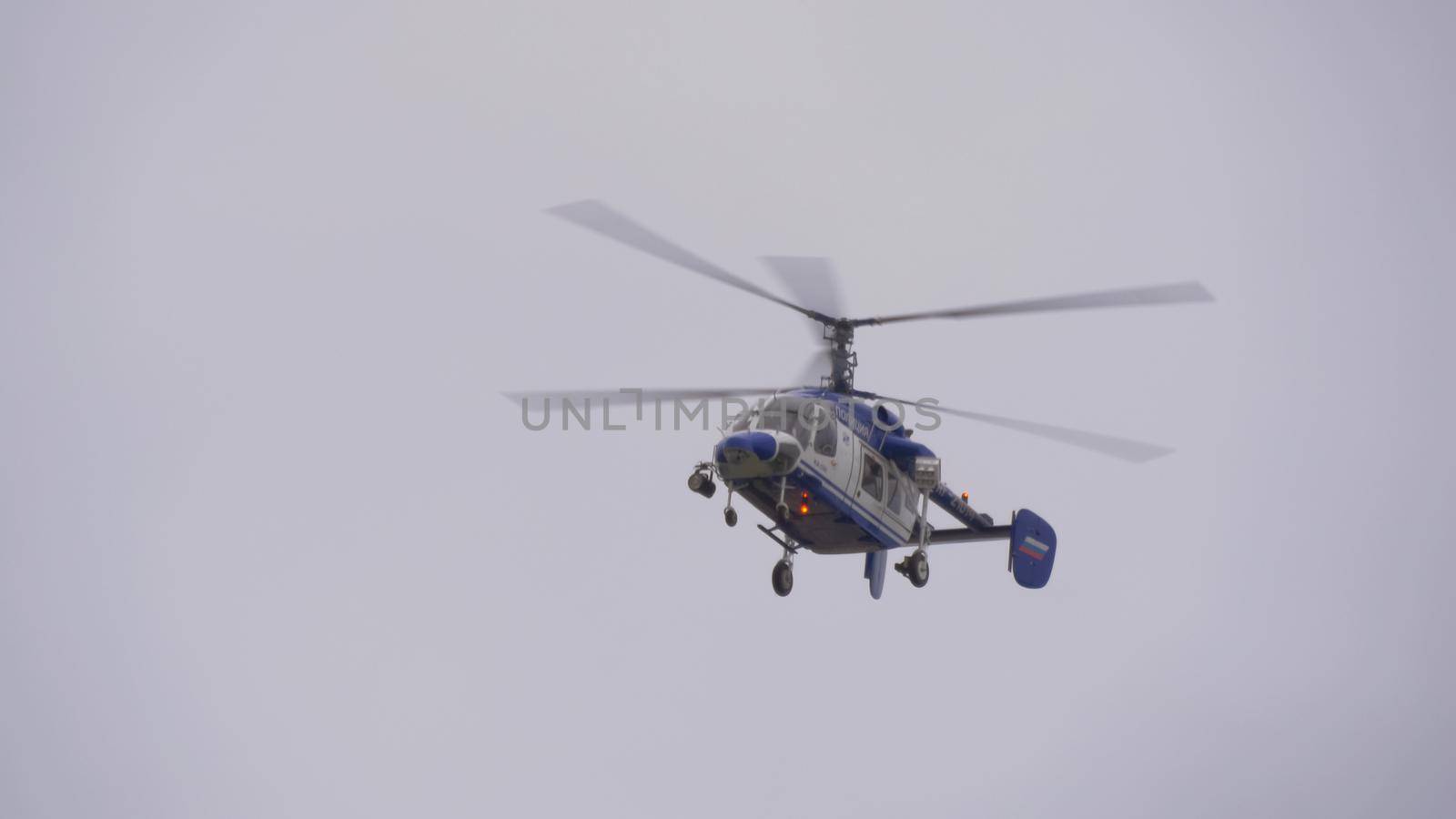 Police hellicopter flying in Russia sky, telephoto