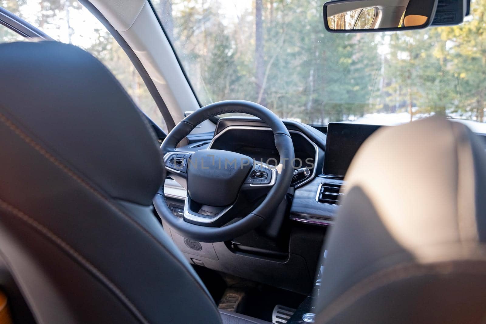 empty modern car interior. empty driver's seat in a premium modern car. steering wheel