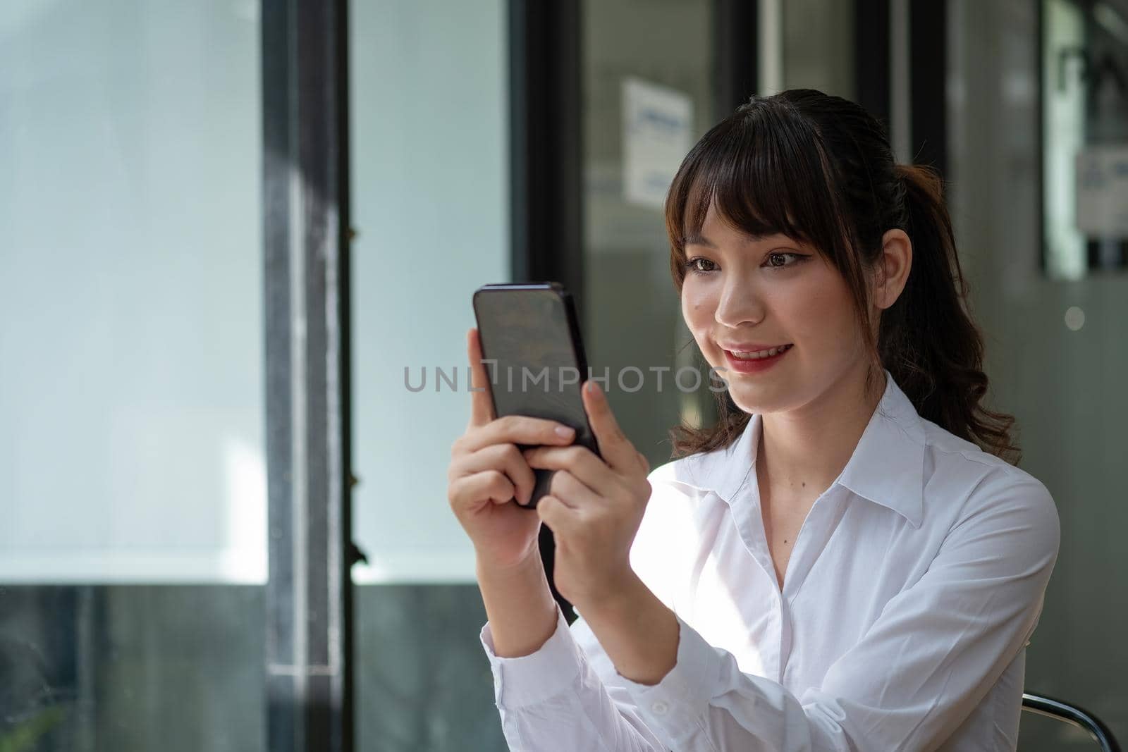 Close up woman use of smart phone, charming asian girl video call via mobile phone.