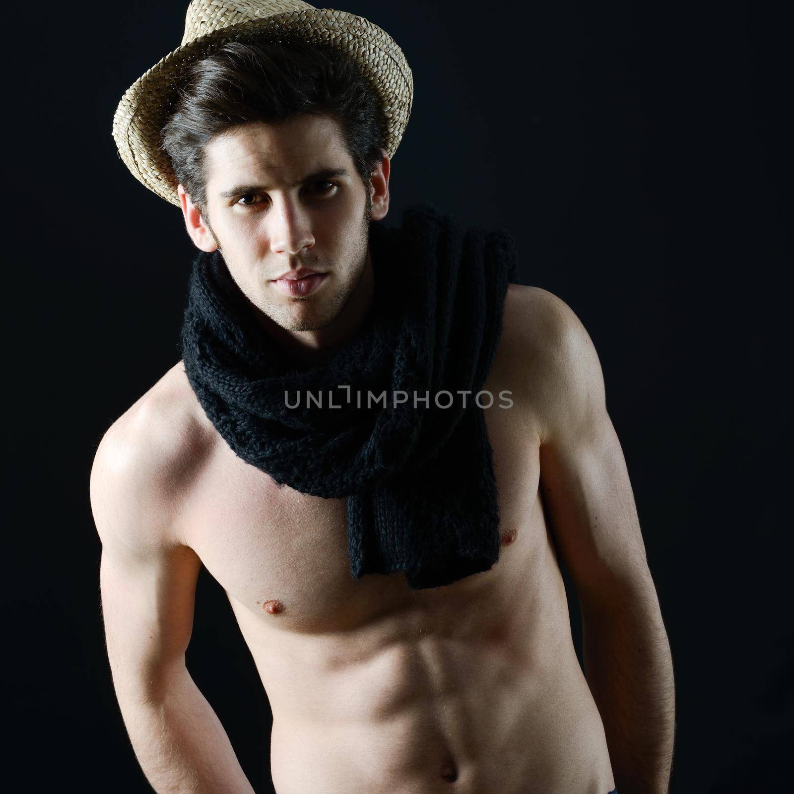 Portrait of handsome man wearing hat and scarf