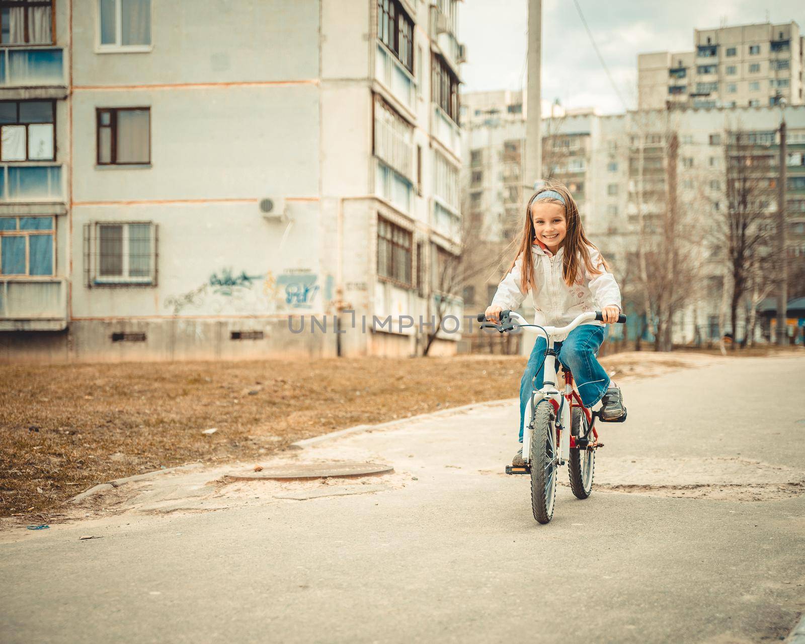 Little girl on a bicycle by GekaSkr