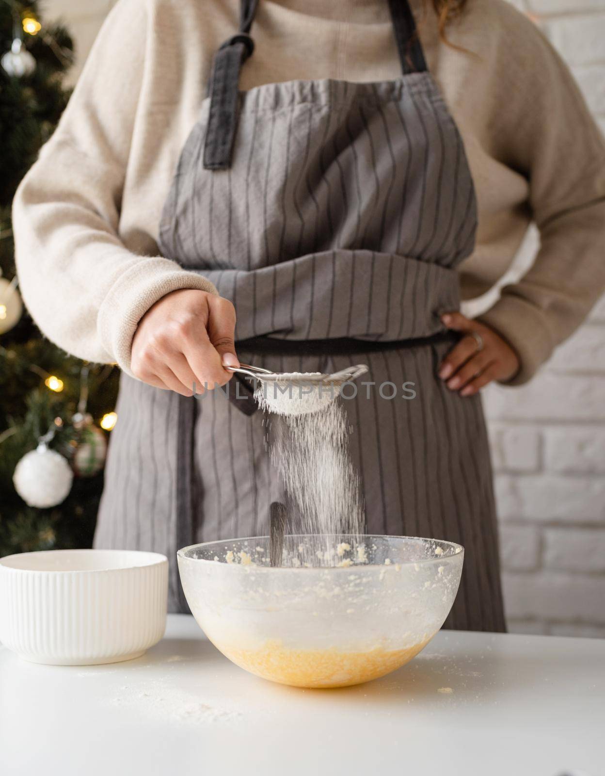 Merry christmas and happy new year. Smiling woman in the kitchen baking christmas cookies