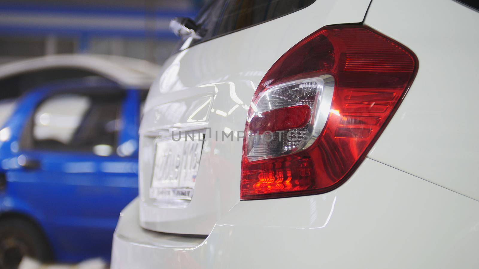 Car preparing for professional diagnostics in auto service, close up, wide angle