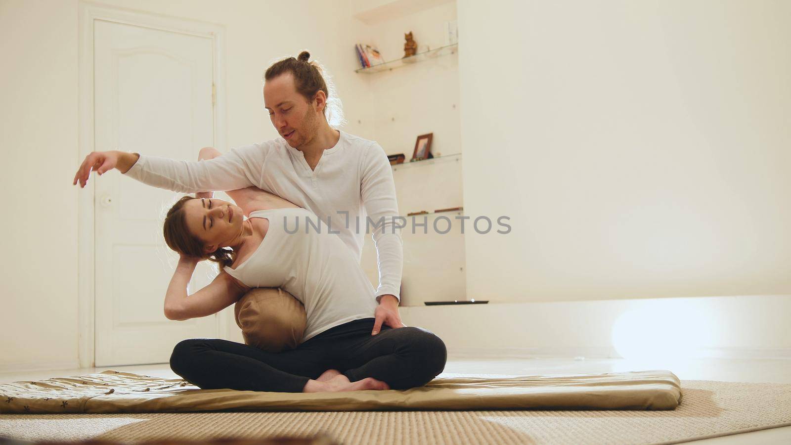 Medical thai massage - caucasian model female - stretch the muscles and spine, horizontal