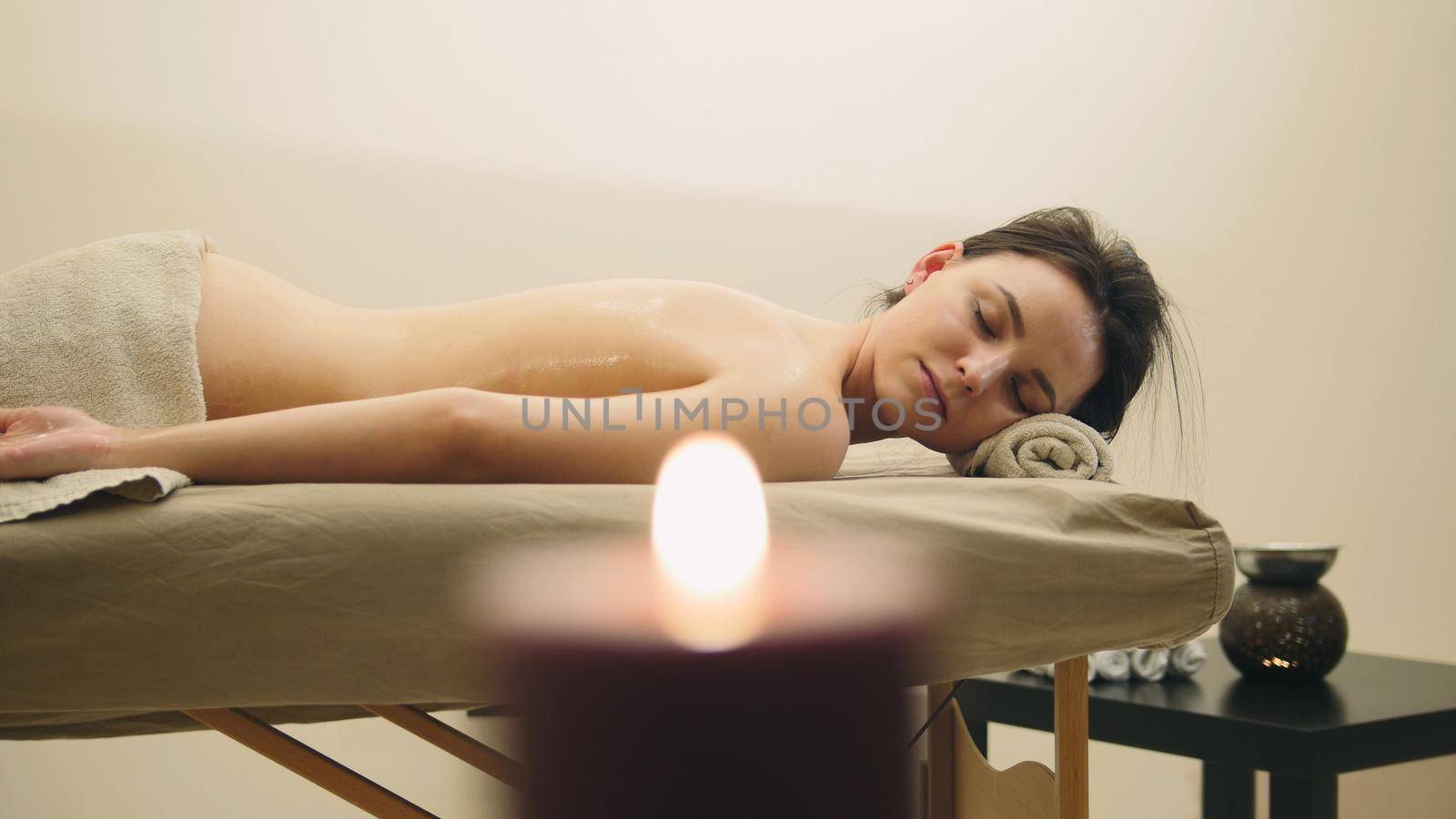 Oil relax massage - half nude young female on parlor, spa concept by Studia72